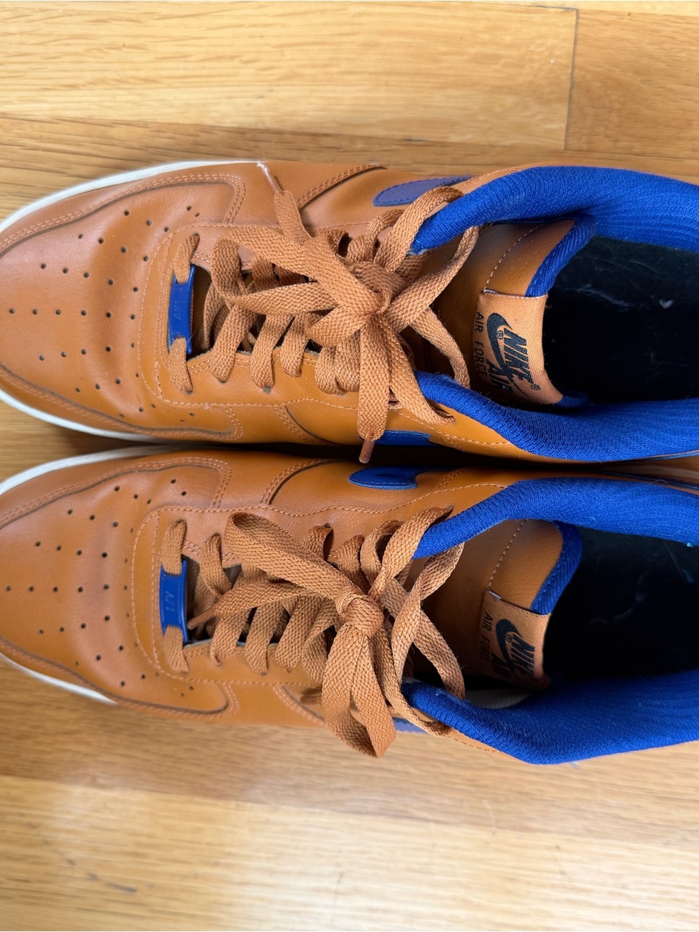 Nike Men’s Tan Leather Sneakers with Blue Collar